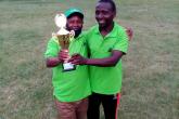 Wanjohi holding Trophy (Defending Champion)